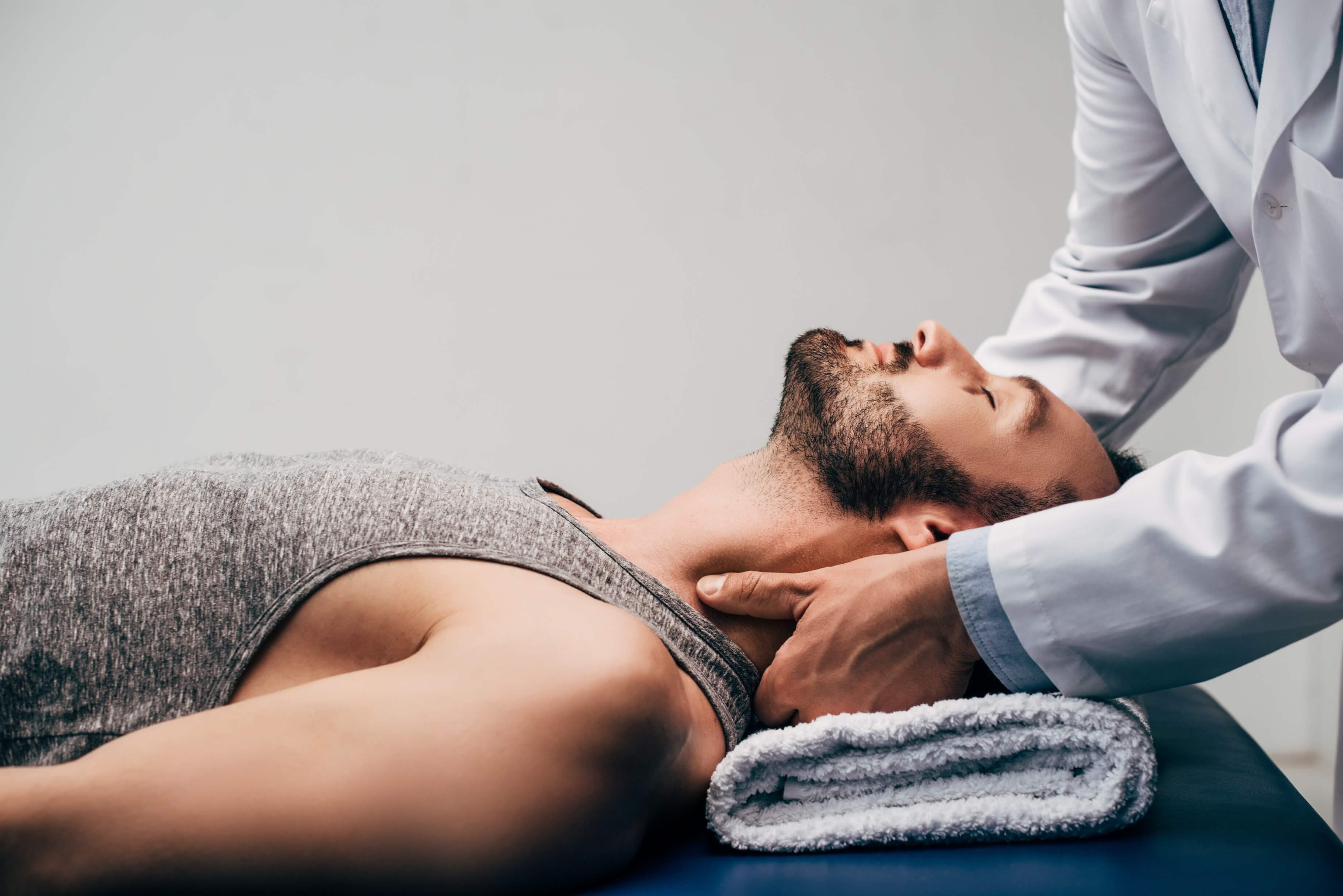Doctor providing neck support to patient